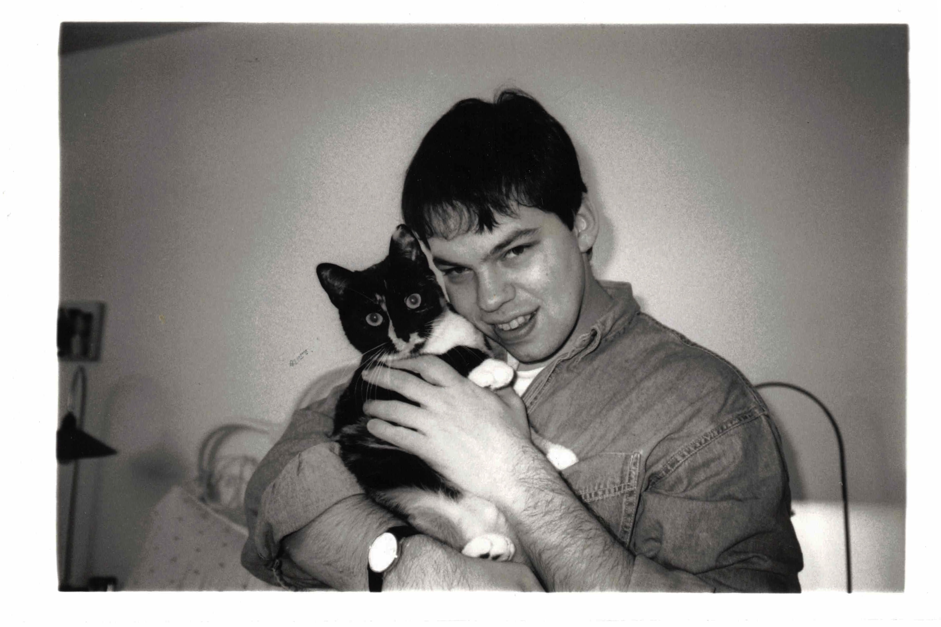 David Rhoden at party with unknown cat, about 1994