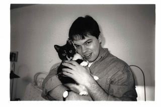 David Rhoden at party with unknown cat, about 1994