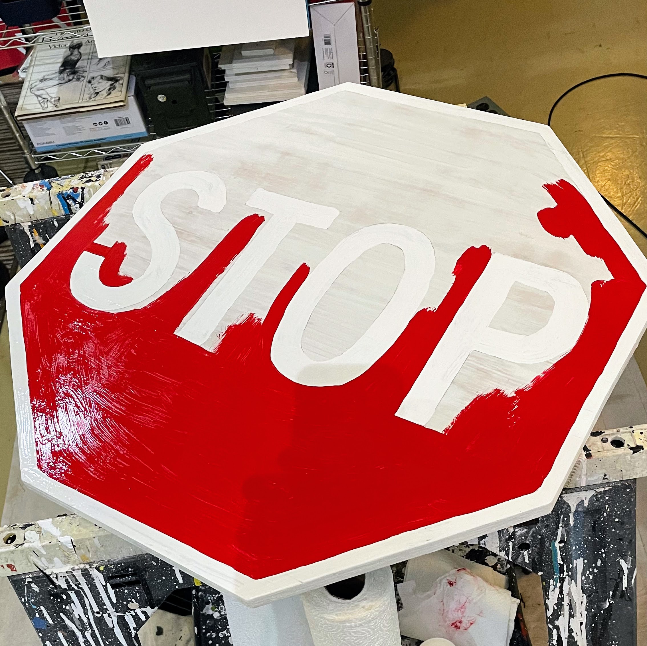 partly-completed stop sign painting by Dave Rhoden