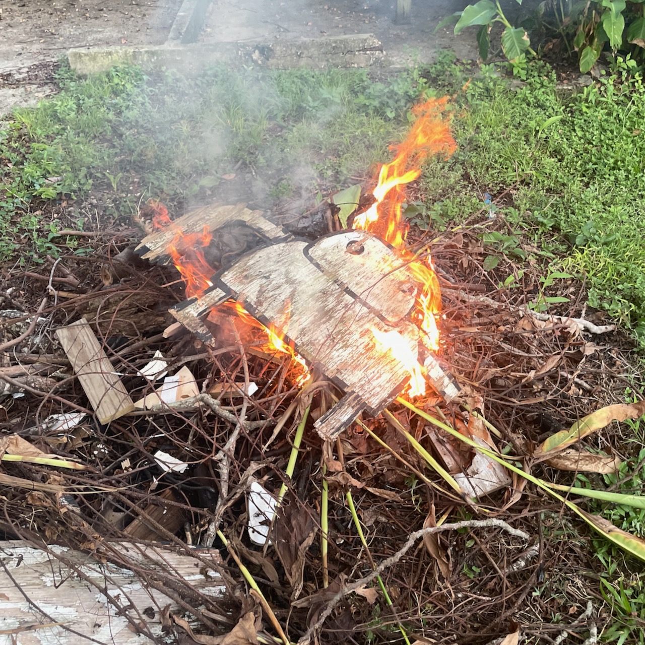 Art by David Rhoden burning in a bonfire