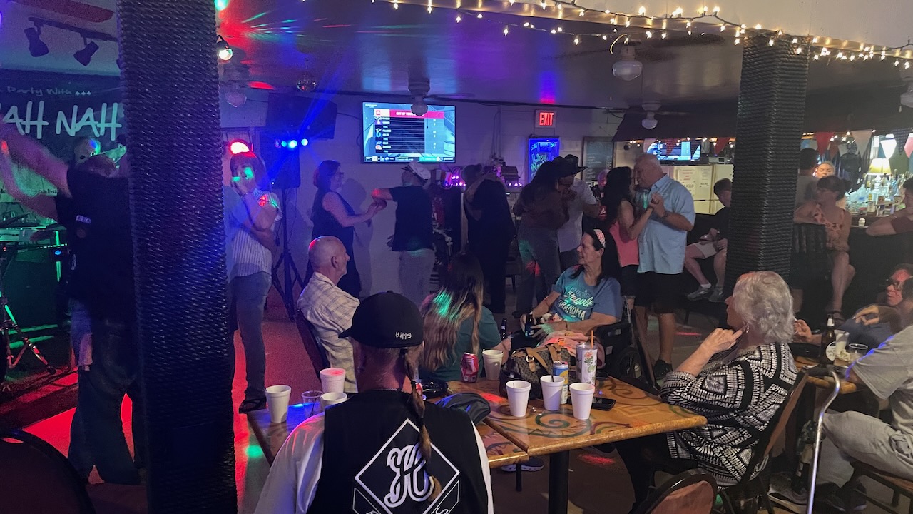 crowd of dancers and patrons at Boomerangs bar.
